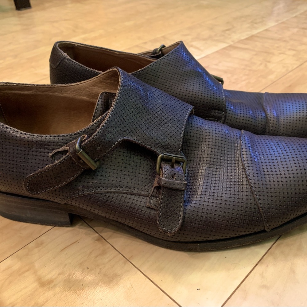 Men’s size 43 Buttero brown leather shoes with strap/buckle closure.